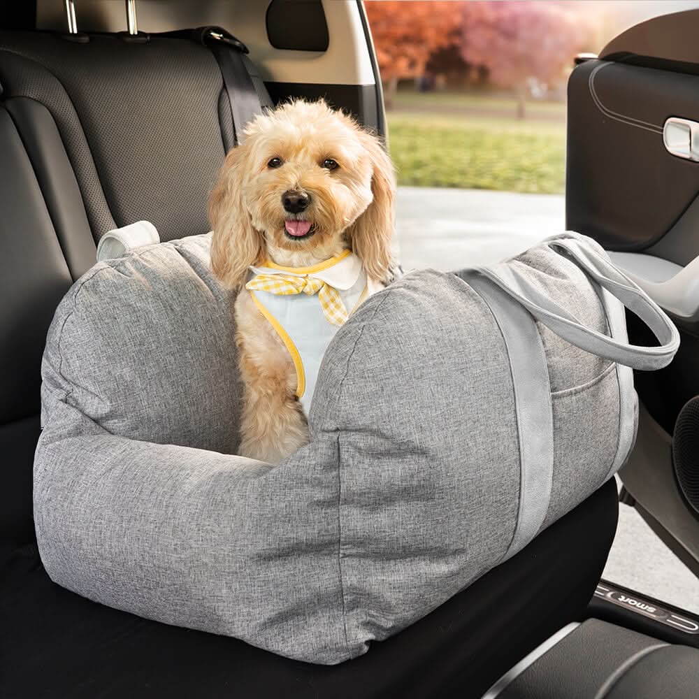 Washable dog car booster seat with strong buckles; secure, comfortable pet travel solution.