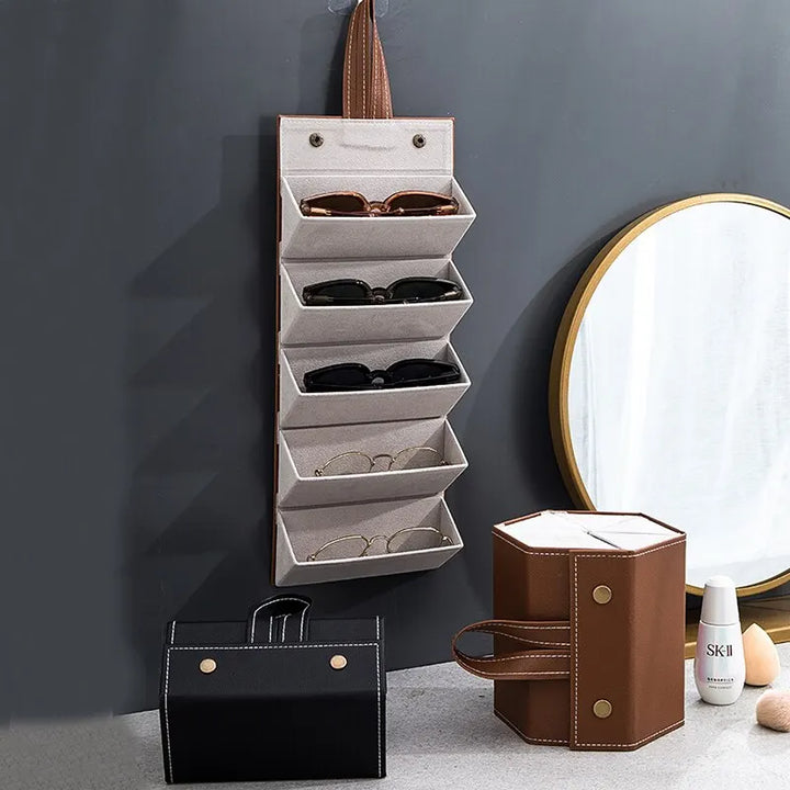 Roll-up multi-slot travel case for eyewear. Securely stores multiple pairs of glasses & sunglasses.