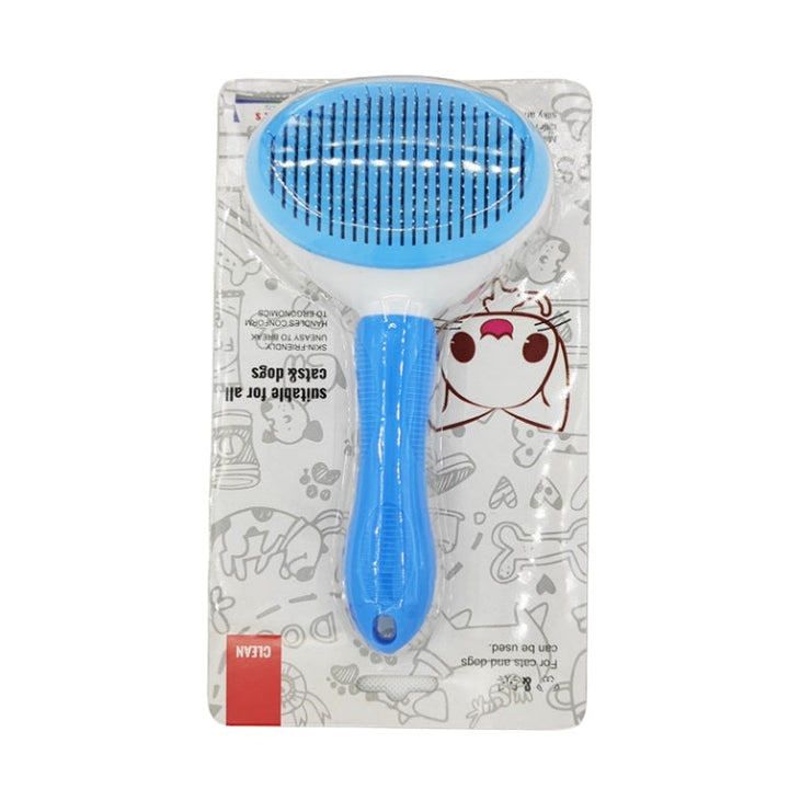 Close-up of pet grooming brush, showing self-cleaning button and bristles