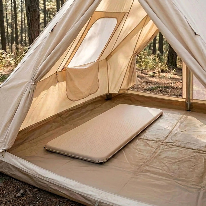 Self-inflating camping sleeping pad for comfortable outdoor adventures and hiking trips, shown unrolled.