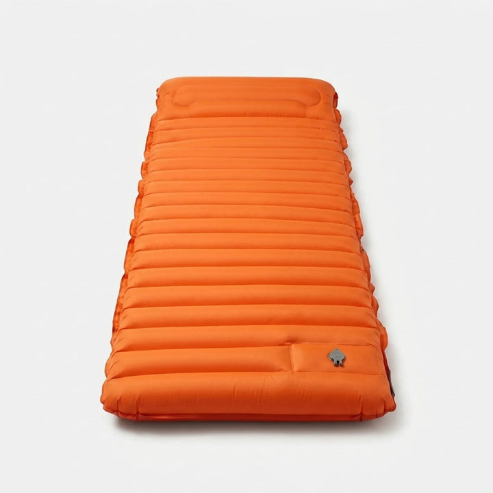 Compact, rolled-up self-inflating sleeping pad, ideal backpacking gear & camping essential for easy transport.