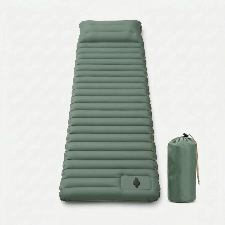 Durable, lightweight self-inflating camping pad next to a backpack & tent, ready for a comfortable night.