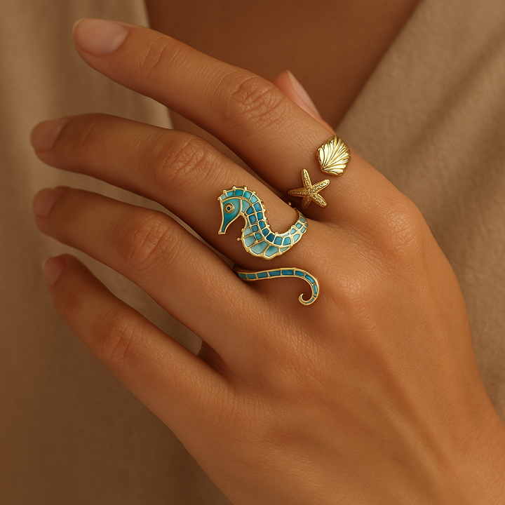 Set of 2 adjustable gold stainless steel rings for women, featuring a seahorse & ocean treasure design. Perfect beach jewelry gift.