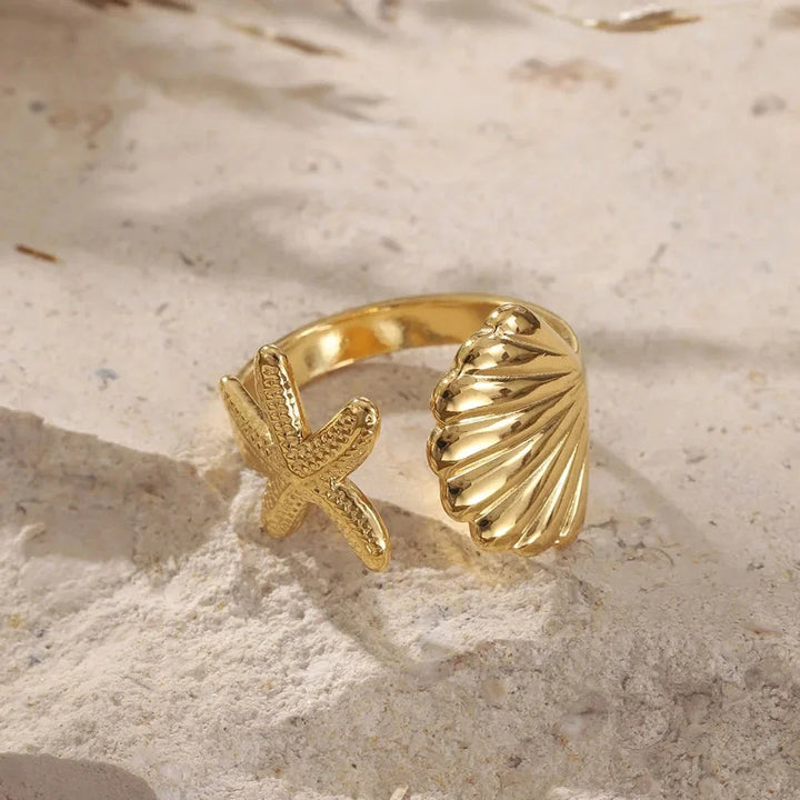 Women's set of 2 adjustable gold rings, stainless steel with ocean treasure theme, includes a charming seahorse & shell detail.