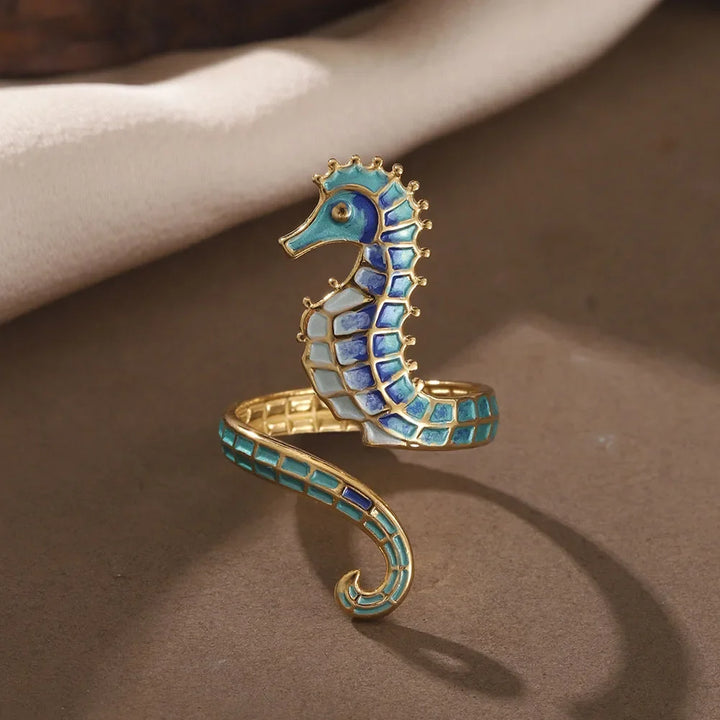 Chic adjustable gold stainless steel women's rings, set of 2, showcasing an ocean seahorse and treasure design. Perfect beach accessory.