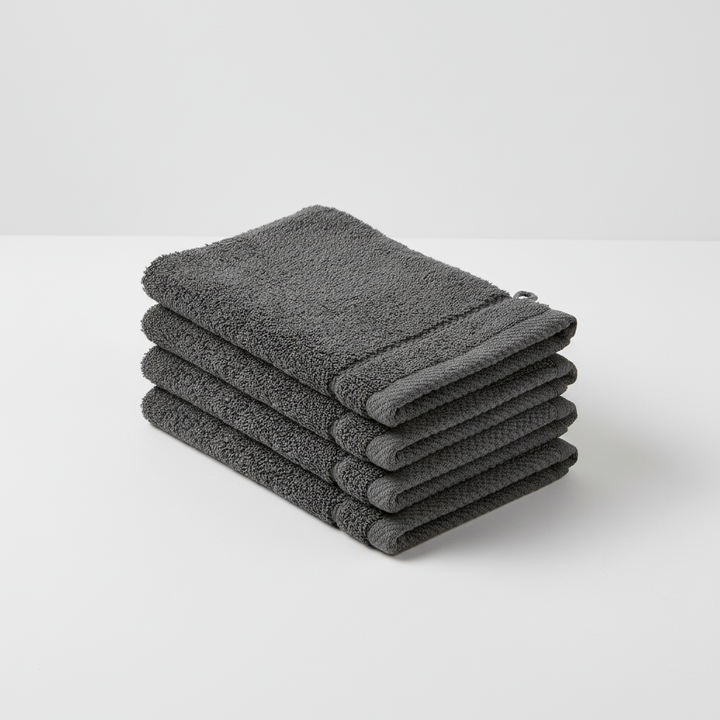 Four-pack unisex dark gray washcloths, durable home textiles for bath or face, featuring absorbent material
