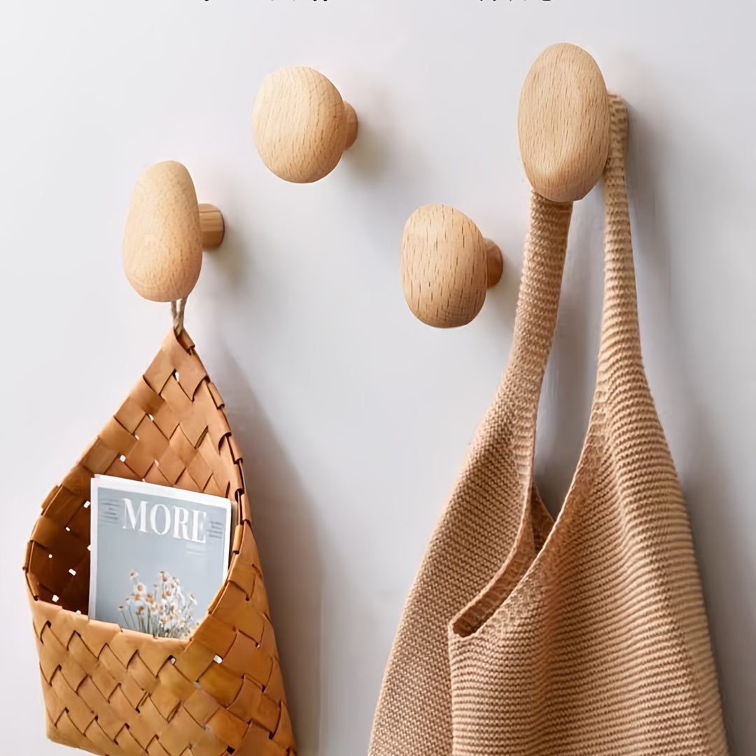 Decorative & functional natural wood pebble wall hooks for coats, towels. Modern home decor & organization.