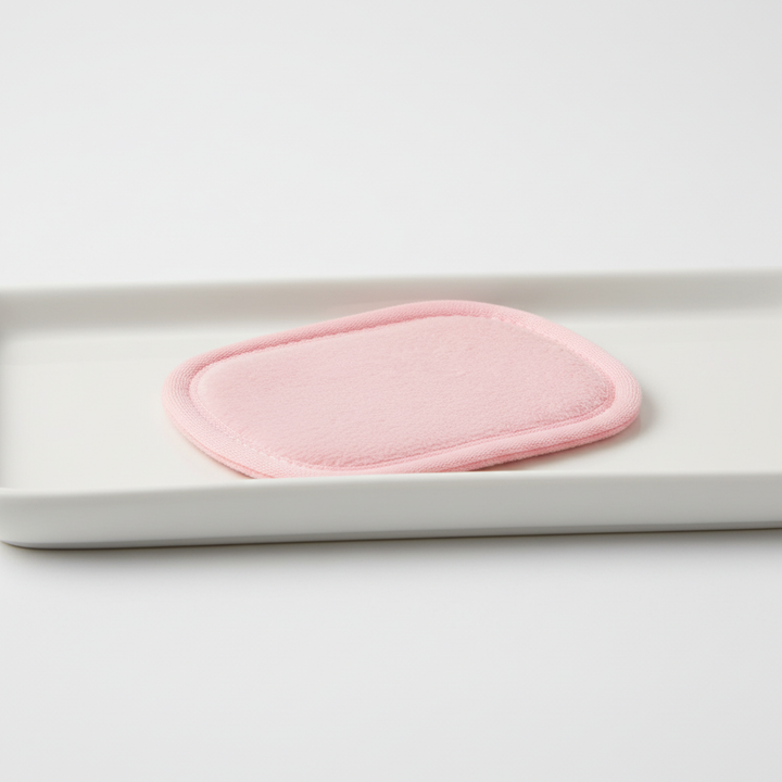 Water droplet on a CleanAway reusable makeup remover pad, emphasizing its absorbency for skincare