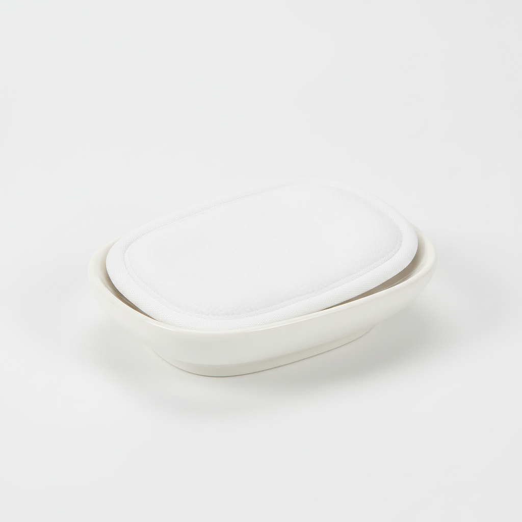 CleanAway reusable makeup remover pad gently wiping away makeup from a face, illustrating its use