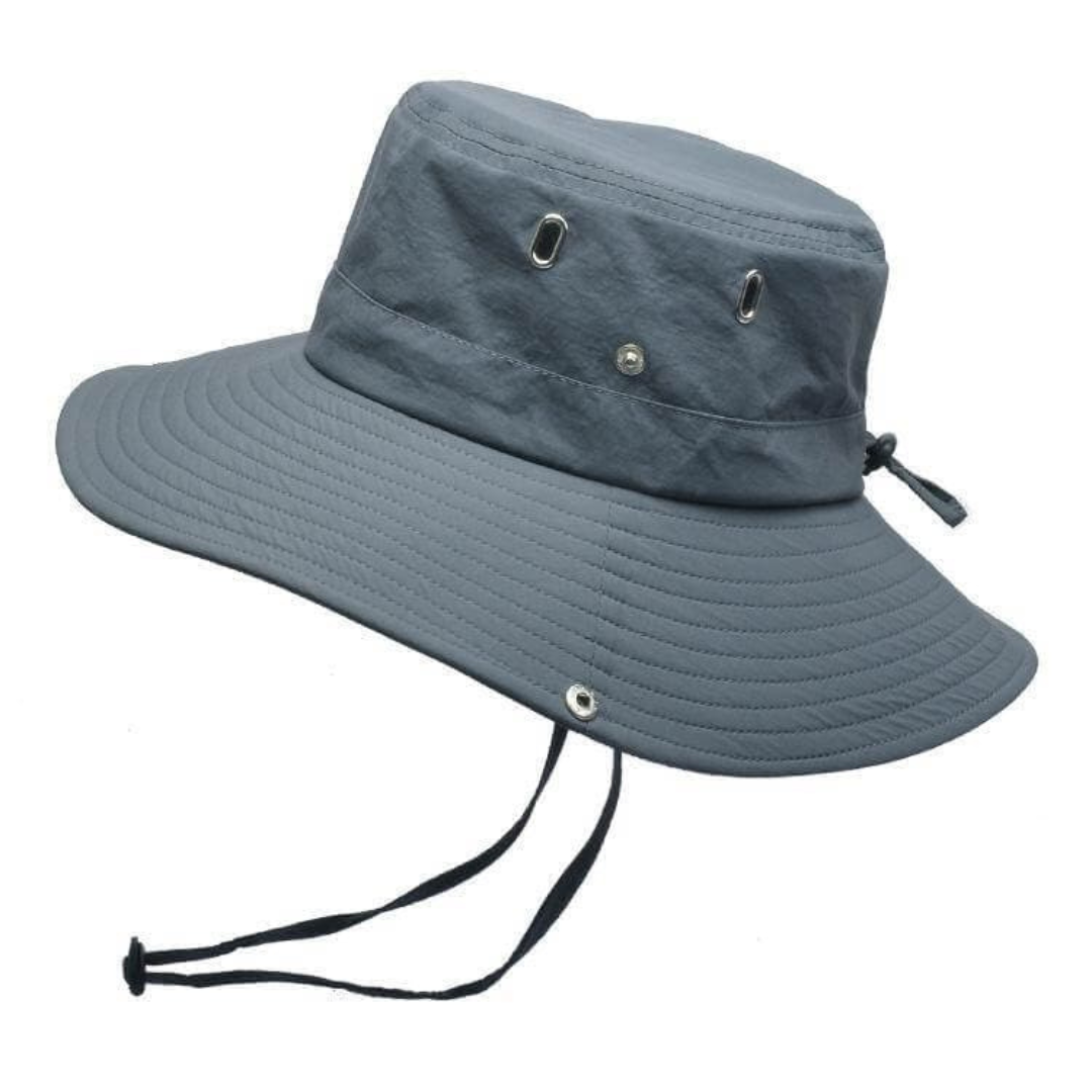 Person wearing a ShieldFlex Pro unisex bucket hat outdoors, enjoying nature