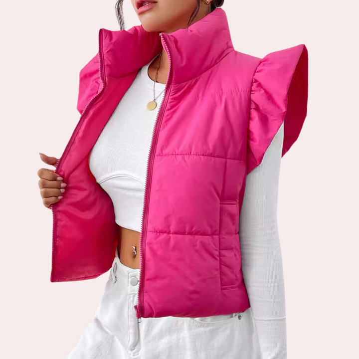 Stylish women's short padded vest. Quilted sleeveless jacket, ideal for winter wear & fashion.