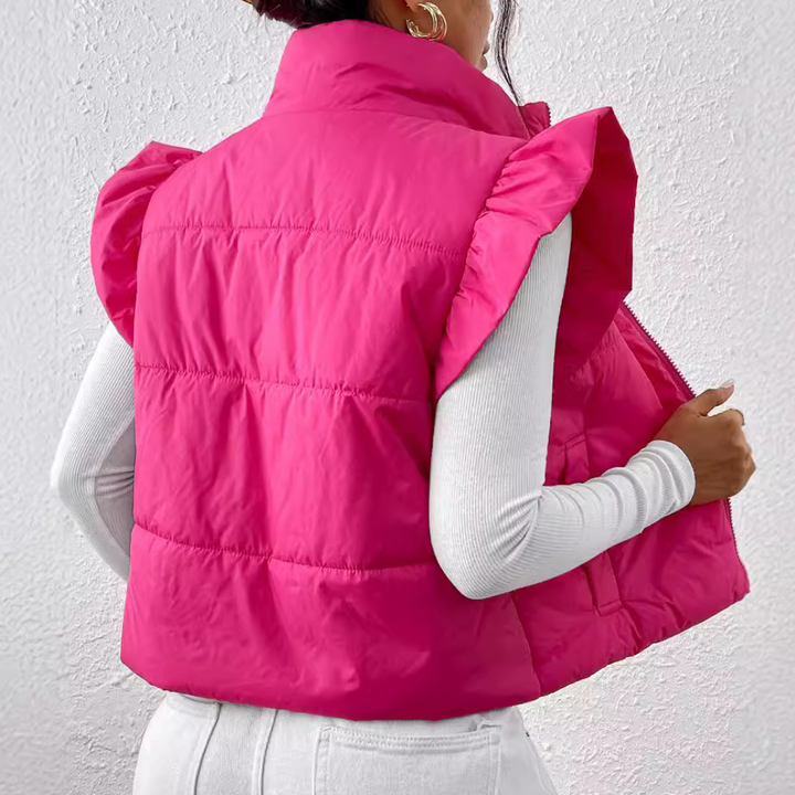 Comfortable women's short padded gilet vest. Warm quilted sleeveless jacket for outdoor activities.
