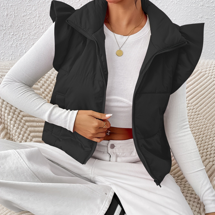 Women's Romy short padded gilet vest. A warm, quilted sleeveless jacket for fall/winter layering.