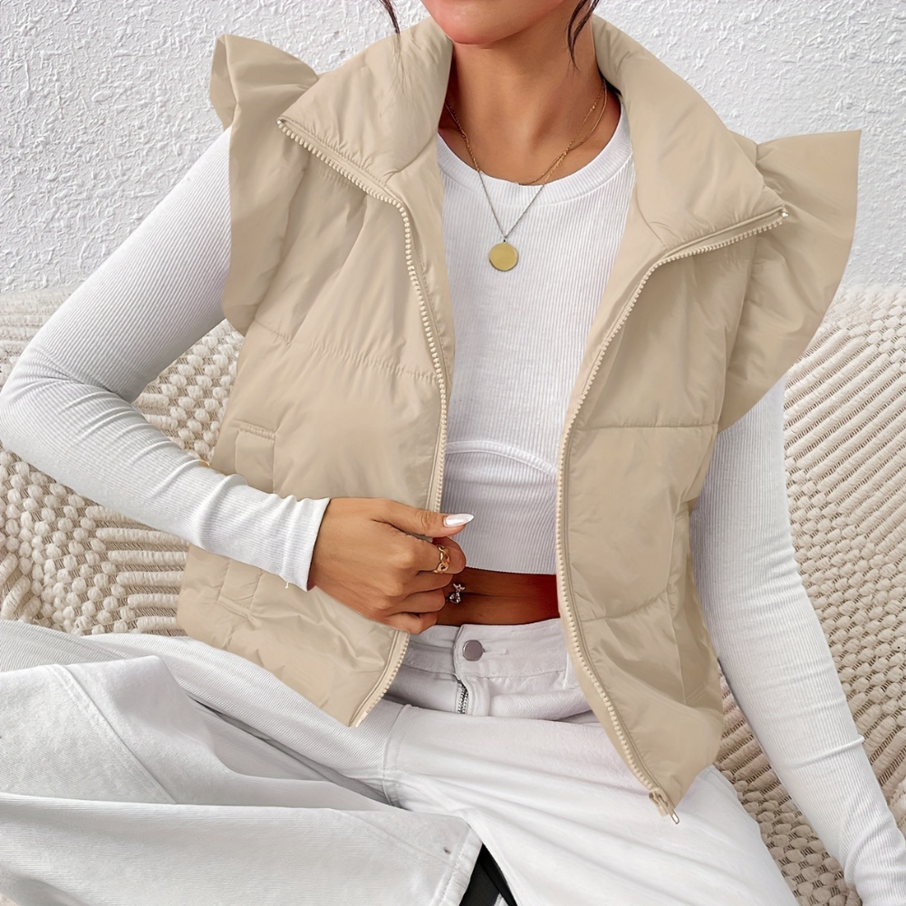 Chic women's short padded gilet. Quilted sleeveless vest, perfect outerwear for fall fashion.