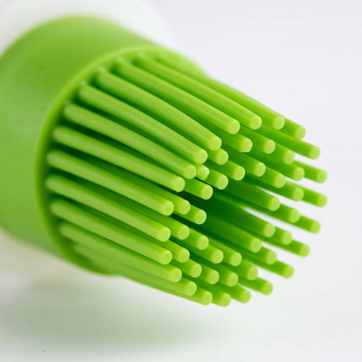 Food-grade silicone dispensing basting brush with reservoir for oil, butter, and marinades. Perfect for baking.