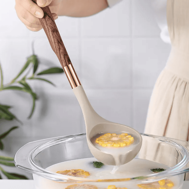 Stylish silicone & wood handle kitchen gadgets, durable and heat-resistant cookware tools.