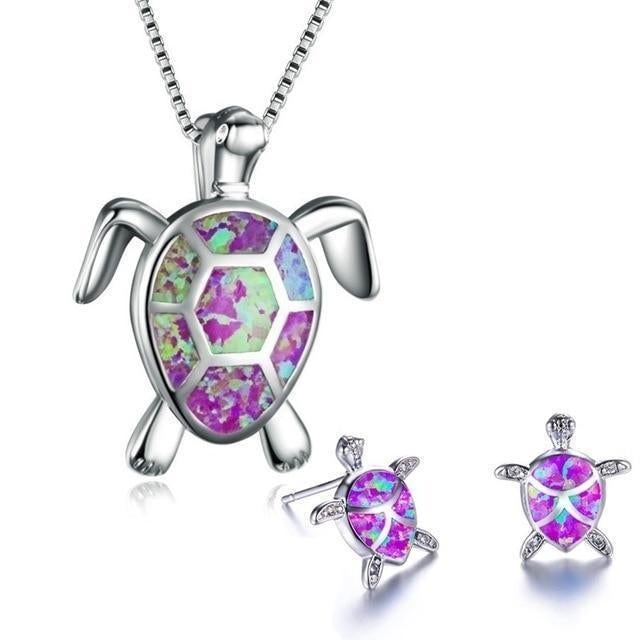 Women's silver sea turtle necklace & earring set, showcasing beautiful blue opal. Ocean animal jewelry.