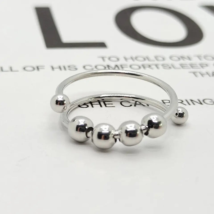 Adjustable stainless steel women's fidget ring, anti-stress spinning design for anxiety relief & daily wear.