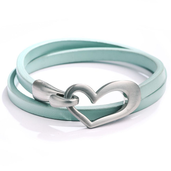 Stylish women's leather wristband featuring a delicate heart charm. Elegant and versatile jewellery.