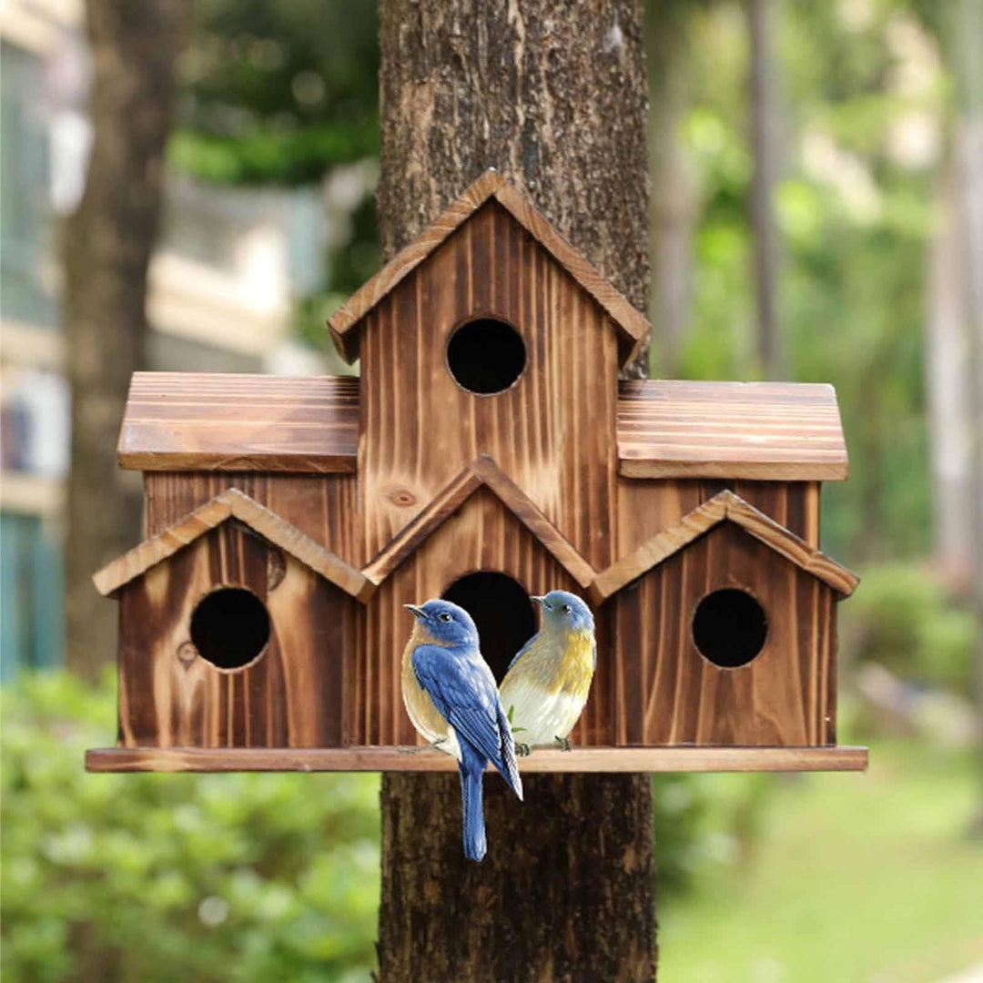 Detailed view of a multi-entrance wooden birdhouse, rustic design for garden wildlife & outdoor living.