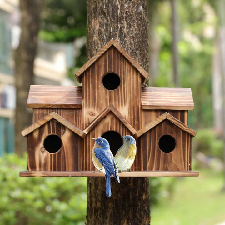 Detailed view of a multi-entrance wooden birdhouse, rustic design for garden wildlife & outdoor living.