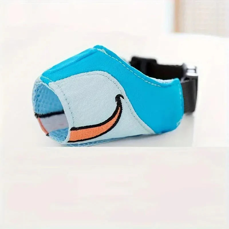 Light brown dog muzzle with cartoon print, adjustable & breathable for safe pet training. An essential pet supply.