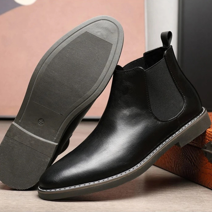 Sleek men's dress boots; black chelsea design, providing comfort and a sophisticated urban appeal.