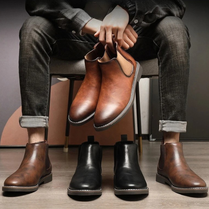 Urban men's fashion: brown pull-on chelsea boots, combining comfort with modern ankle boot style.