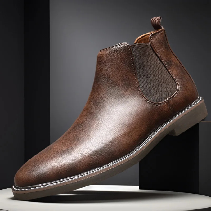 Comfortable men's pull-on chelsea boots in dark brown, perfect for both casual and dress occasions.