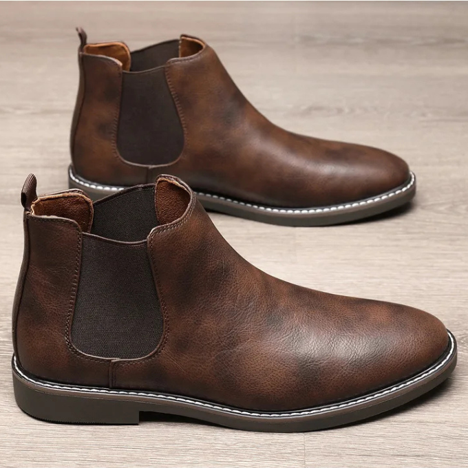 Stylish men's ankle boots; classic chelsea design with elastic sides, ideal for urban fashion.