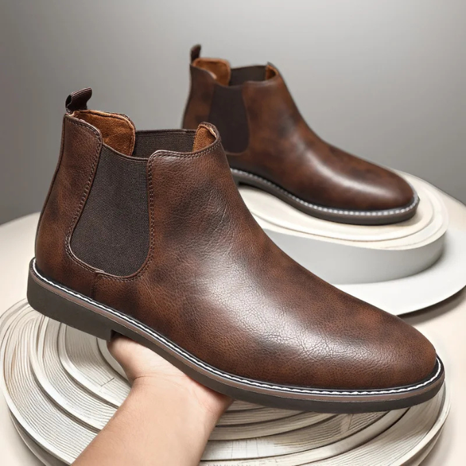 Versatile men's dress boots: black chelsea style, combining sleek design with ultimate comfort.