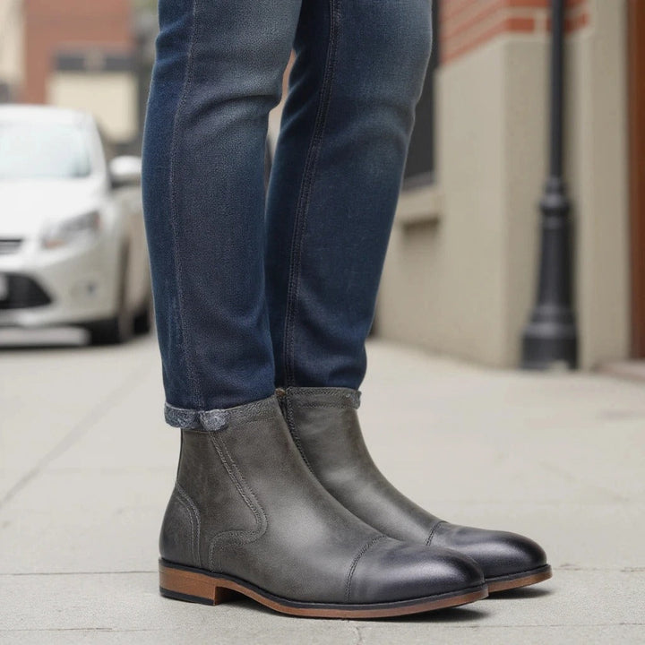 Sleek brown leather men's Chelsea boots with side-zip, ideal for smart-casual outfits.