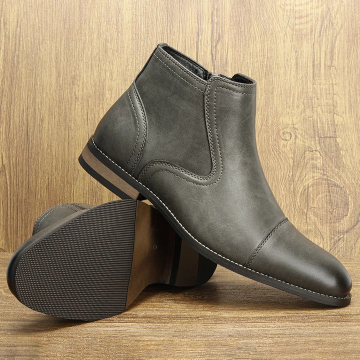 Comfortable men's brown leather Chelsea dress boots with convenient side-zip closure.