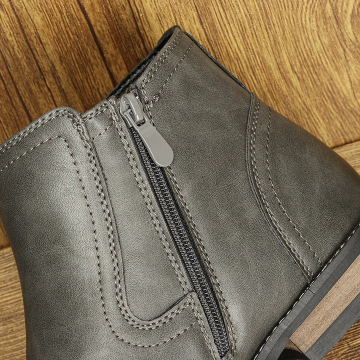 Modern men's brown Chelsea boots featuring a sleek side-zip, durable and fashionable.