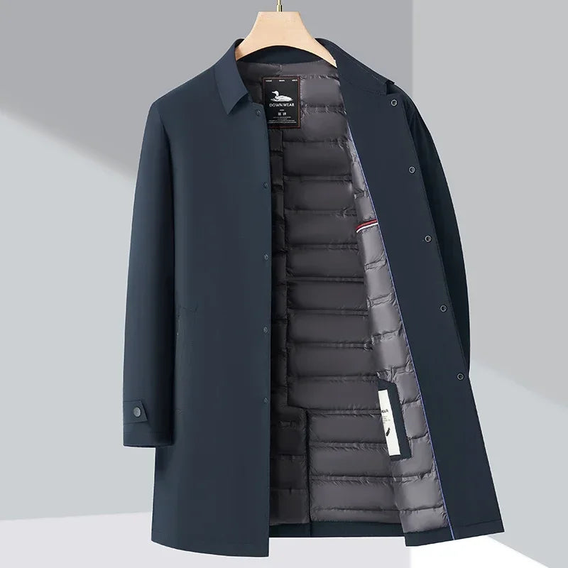Sleek men's insulated city trench coat in a dark color, perfect for sophisticated urban winter style and warmth.