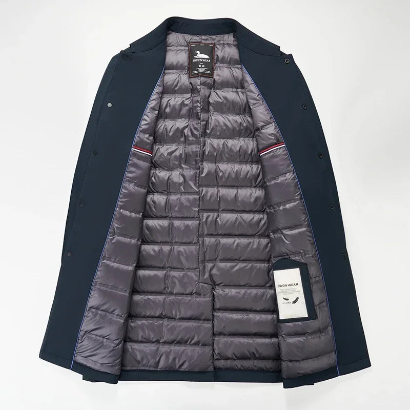 Classic black men's insulated trench coat, offering warmth and sophisticated style for cold city weather. Urban outerwear.
