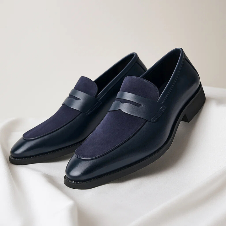 Black men's slip-on penny loafers, elegant and comfortable for dress or casual wear. Stylish mens footwear.