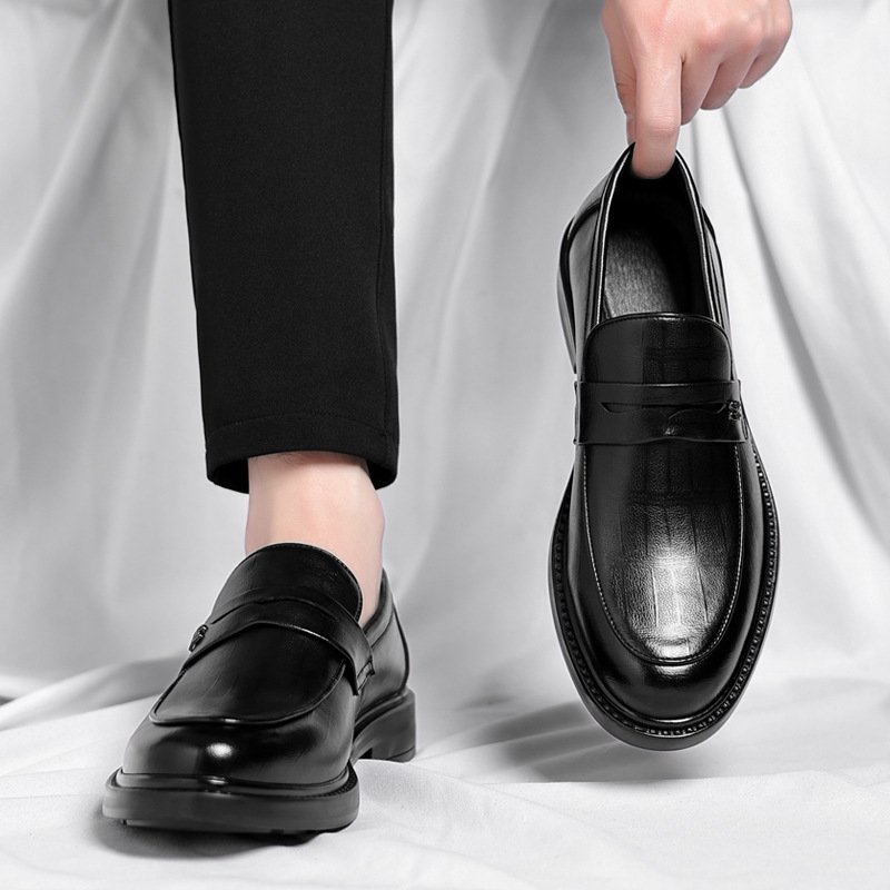 Men's classic slip-on loafers offering sleek design and everyday comfort. Ideal casual or dress shoes.