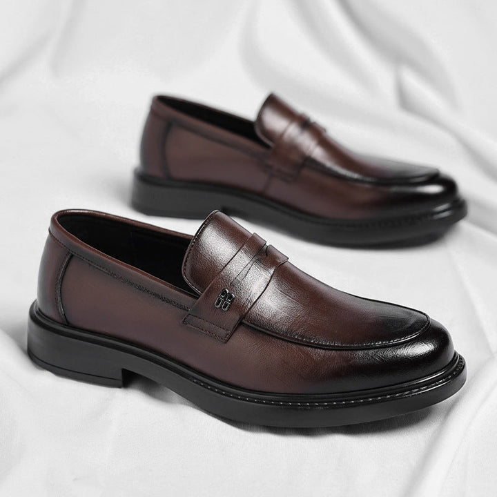 Classic men's penny loafers. Comfortable slip-on shoes for casual everyday style. Sleek design.
