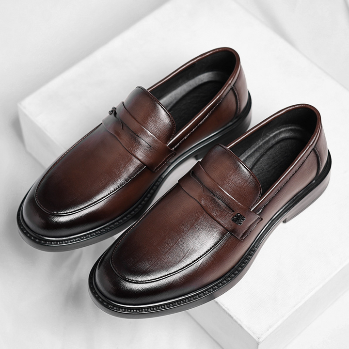 Comfortable men's slip-on loafers, ideal for everyday style. Sleek design for casual or dress occasions.