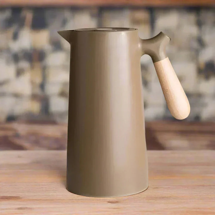 Modern NordicTherm stainless steel thermal flask, a sleek and reusable bottle for hot beverages or cold water.