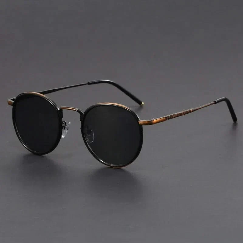 Sleek unisex metal frame sunglasses providing anti-glare & UV protection. Essential fashion eyewear accessory.