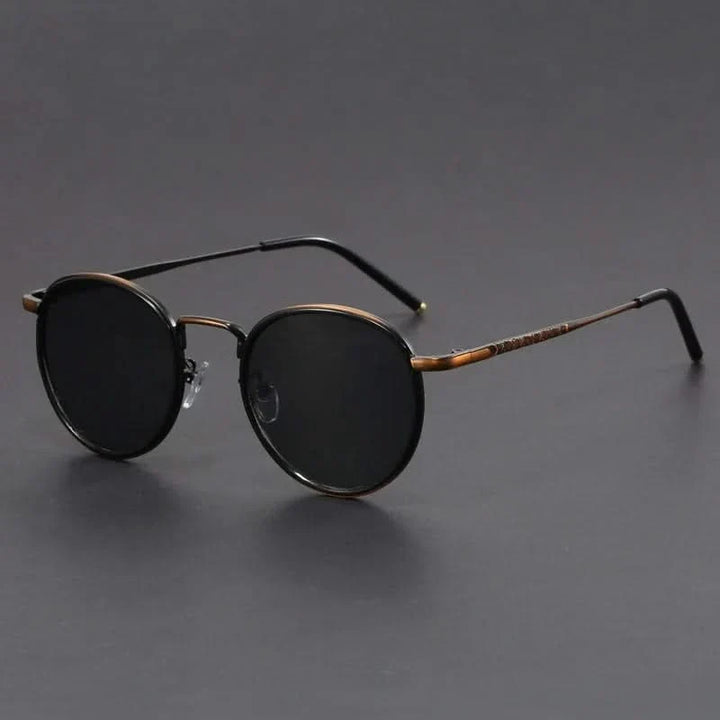 Sleek unisex metal frame sunglasses providing anti-glare & UV protection. Essential fashion eyewear accessory.