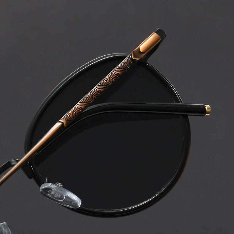 Fashionable unisex shades with a sleek metal frame, featuring anti-glare & UV protection for optimal vision.