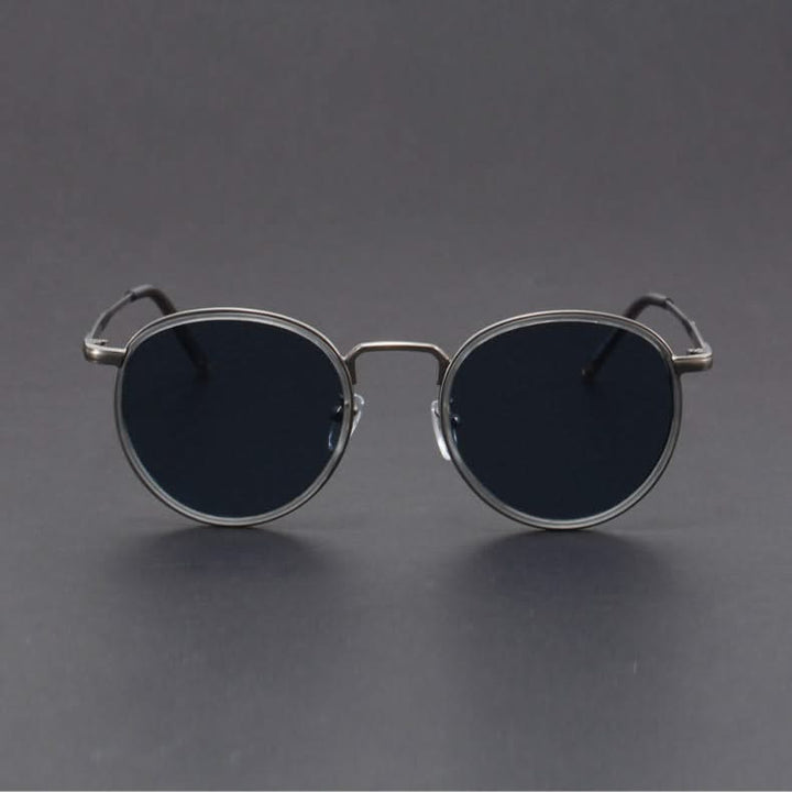 Elegant unisex metal frame sunglasses with dark lenses, offering anti-glare properties & full UV protection.