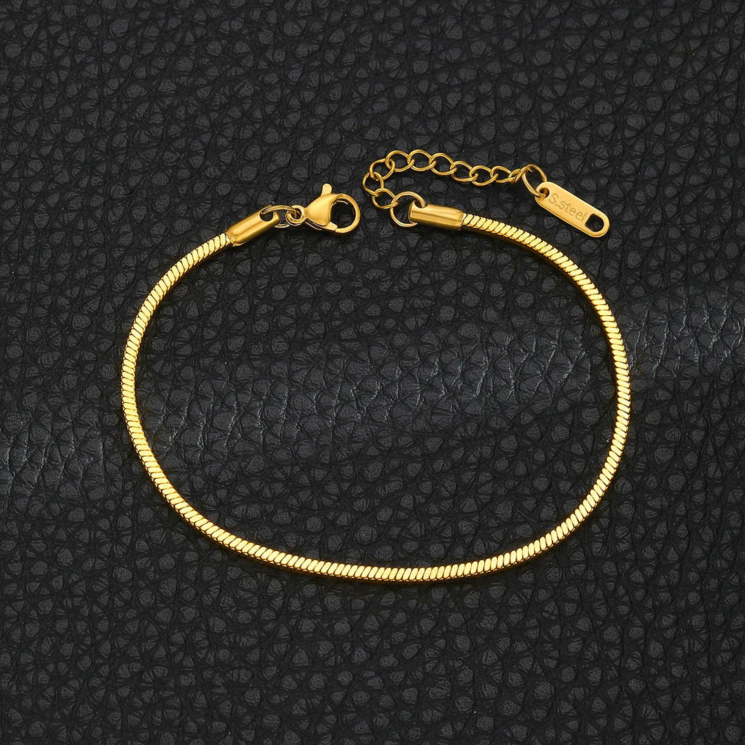 Elegant gold tone minimalist stainless steel bracelet, a durable and sleek unisex accessory for all occasions.