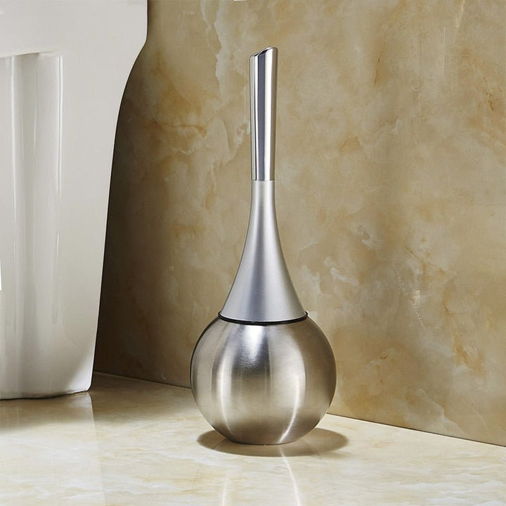 Hygienic modern silver-accented toilet brush. Features an advanced silicone cleaning head and a sleek drip-free holder.