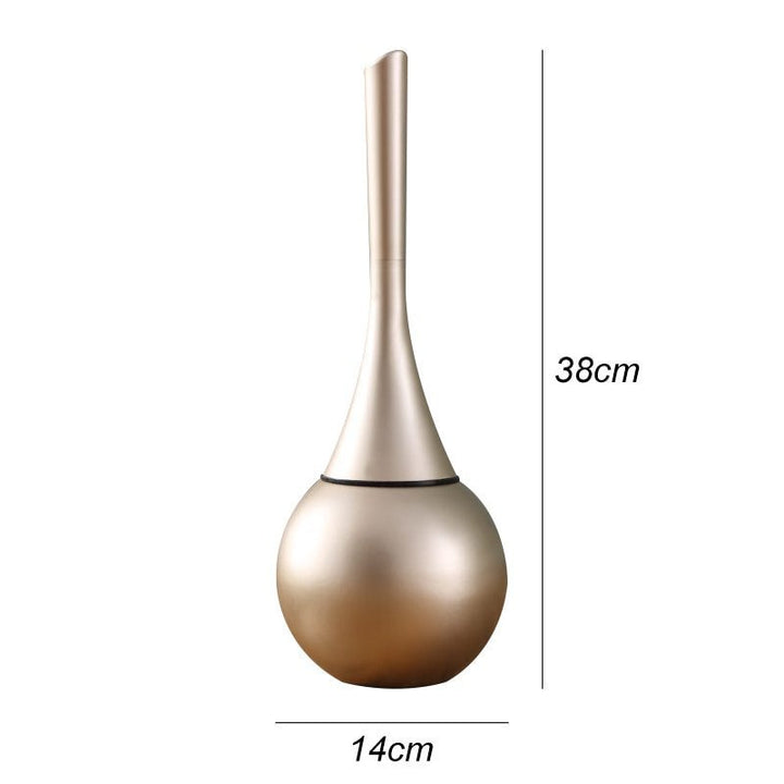 Stylish gold-accented toilet brush with advanced silicone cleaning head. Sleek, drip-free, perfect modern bathroom decor.