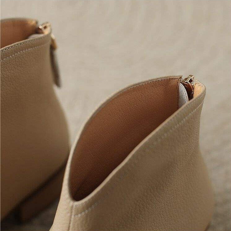 Stylish women's slip-on ankle boots. Features a sharp pointed toe and subtle low heel.