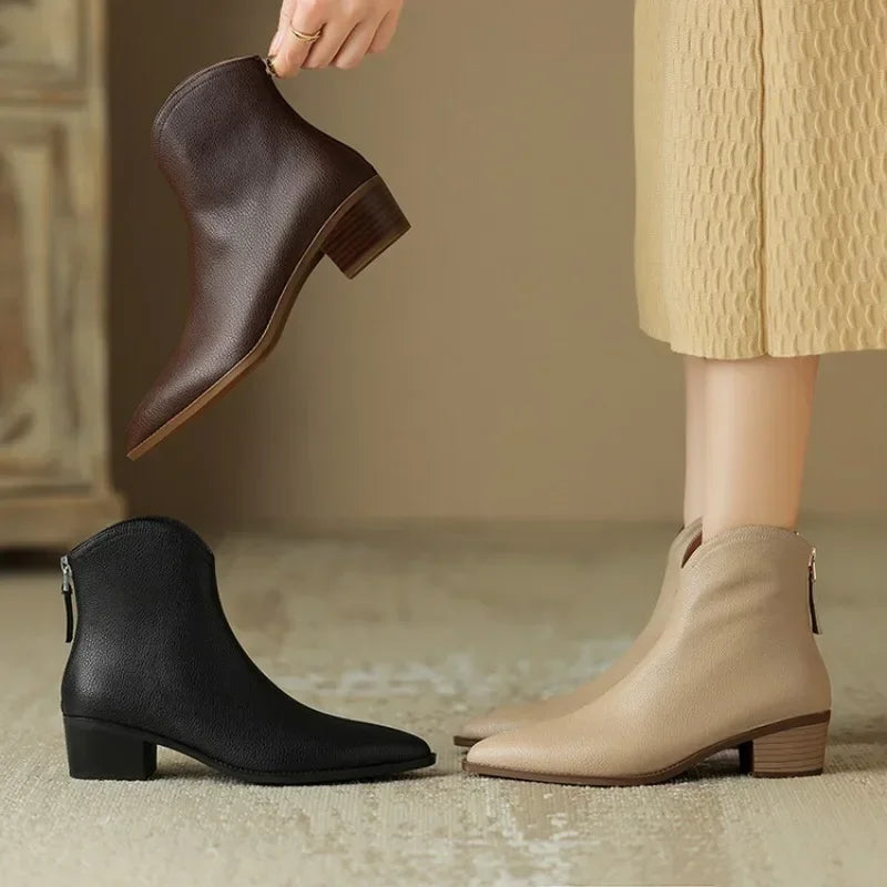 Feminine women's ankle boots. Chic pointed toe and low heel offer versatile and comfortable style.